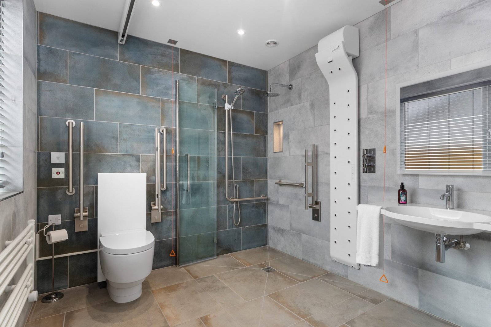 Accessible wetroom with shower screen folded flat and shower seat removed