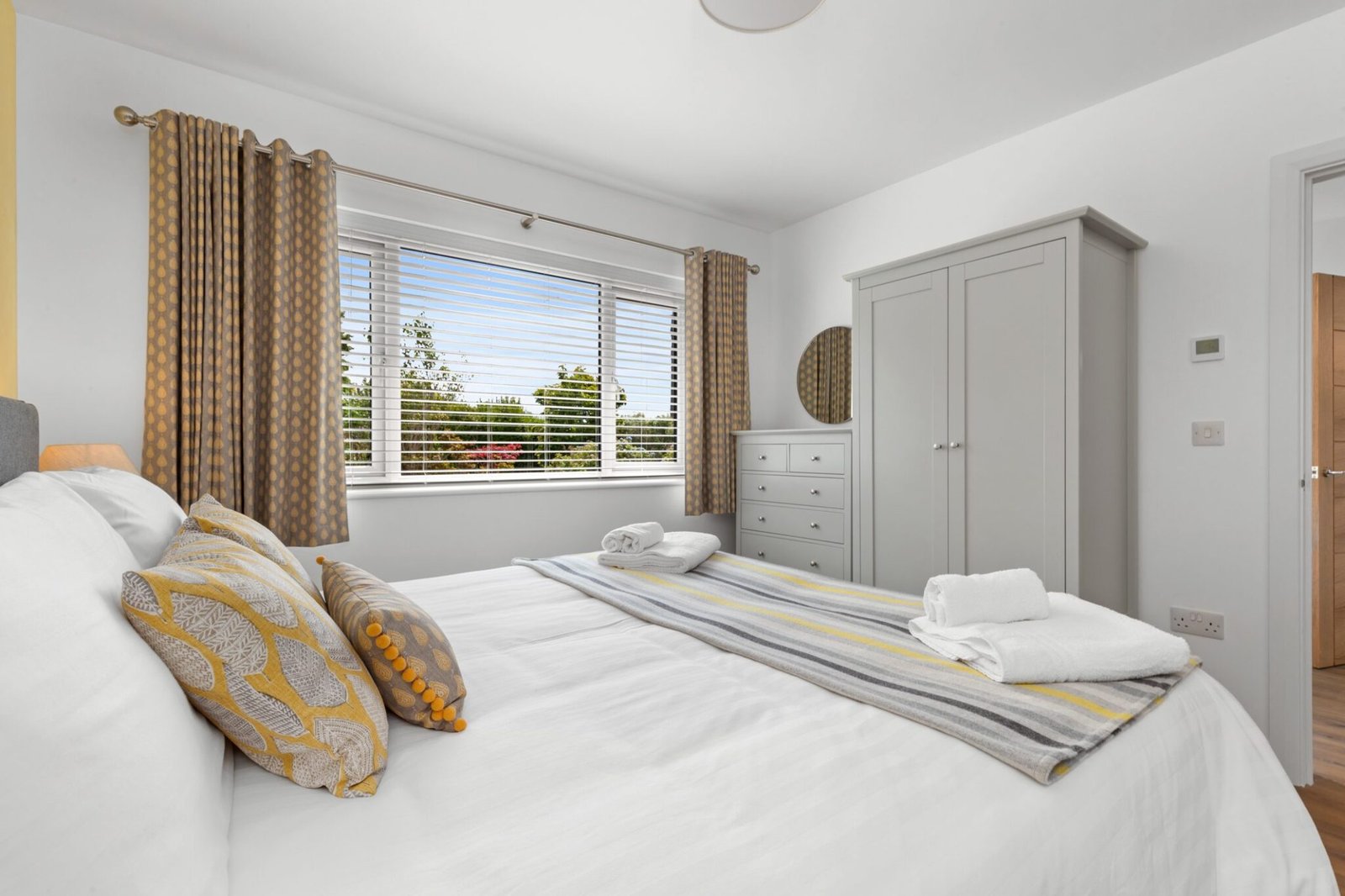 Natural daylight floods the super-king bedroom