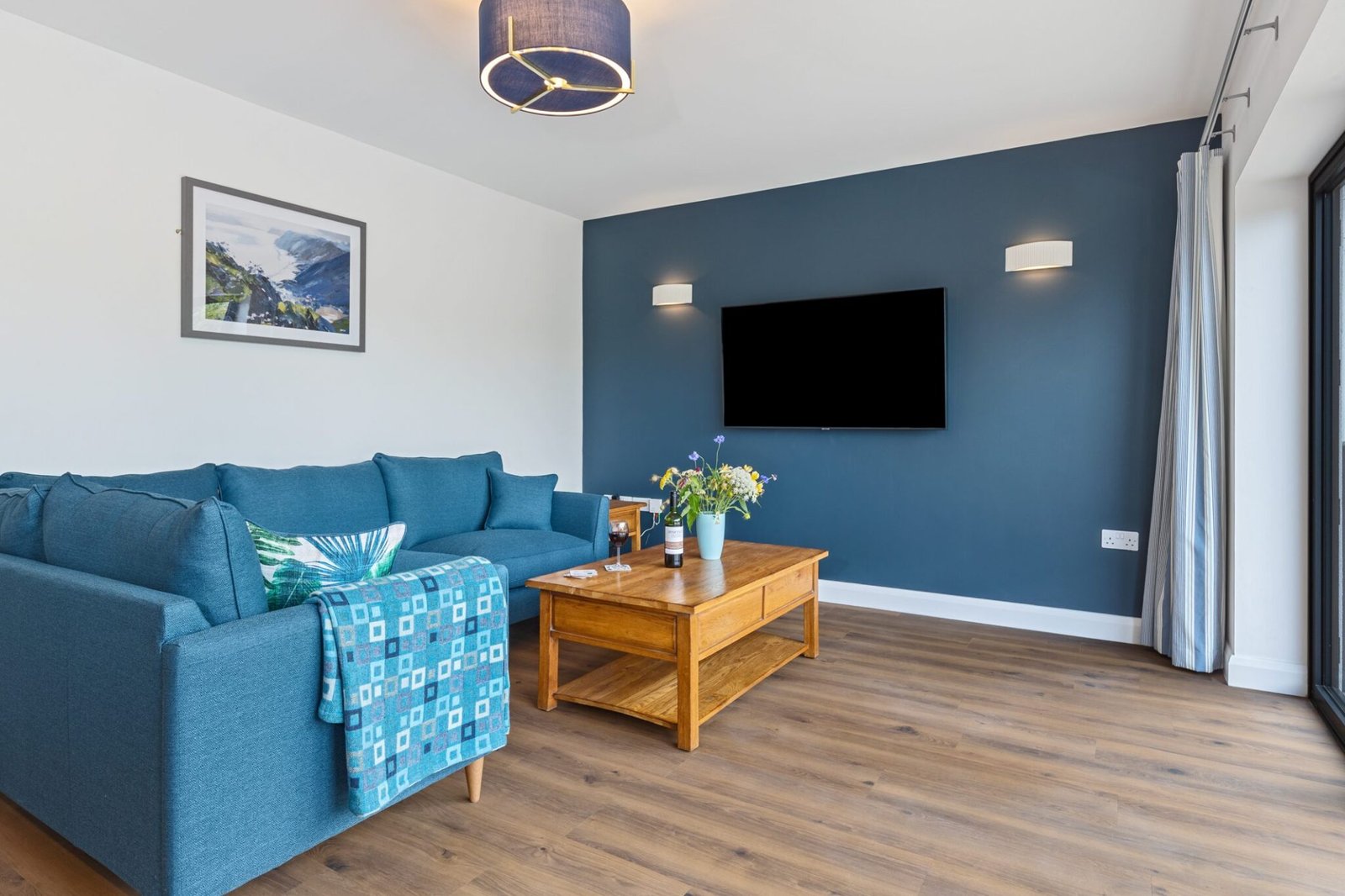 Open-plan lounge and wall mounted TV